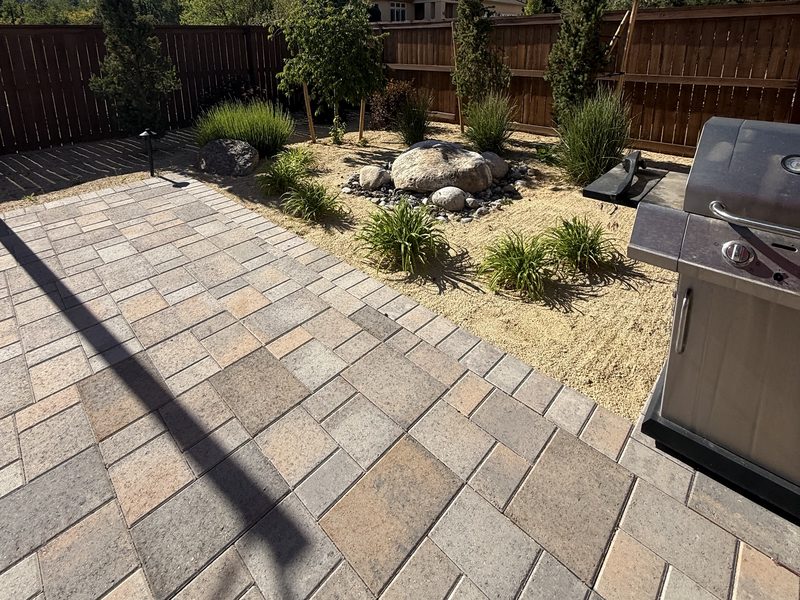 Backyard patio and xeriscape beds reset by Sierra Lawn Co. spring cleanup in Sparks, Nevada