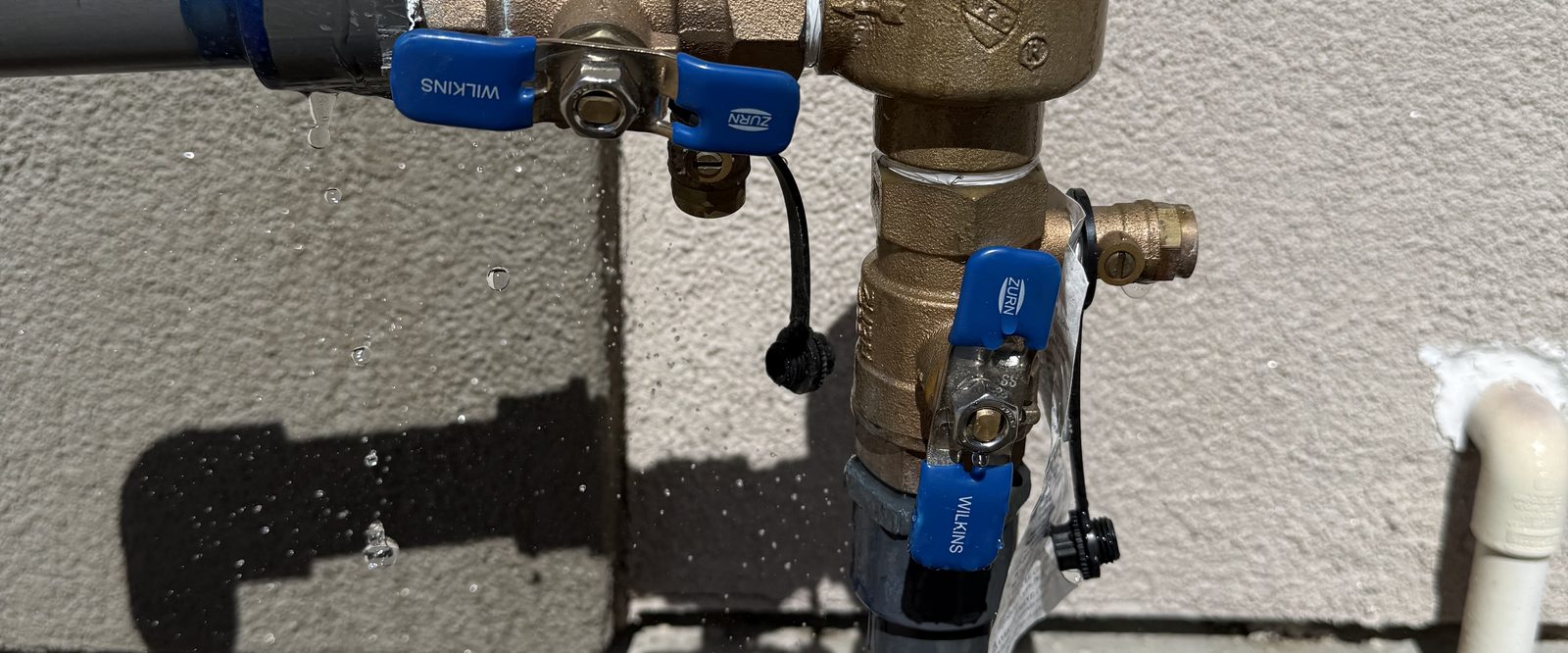 Leaking backflow preventer valve being repaired by Sierra Lawn Co. in Sparks, Nevada